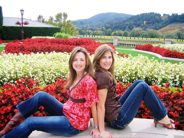 Two guests enjoying a colorful garden stop in wine country