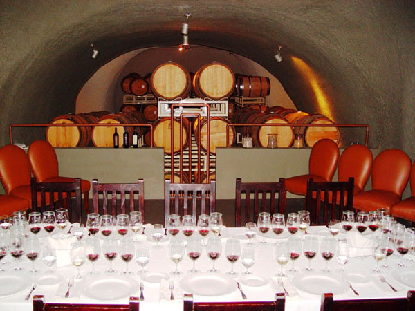 Private tasting table prepared inside a barrel room